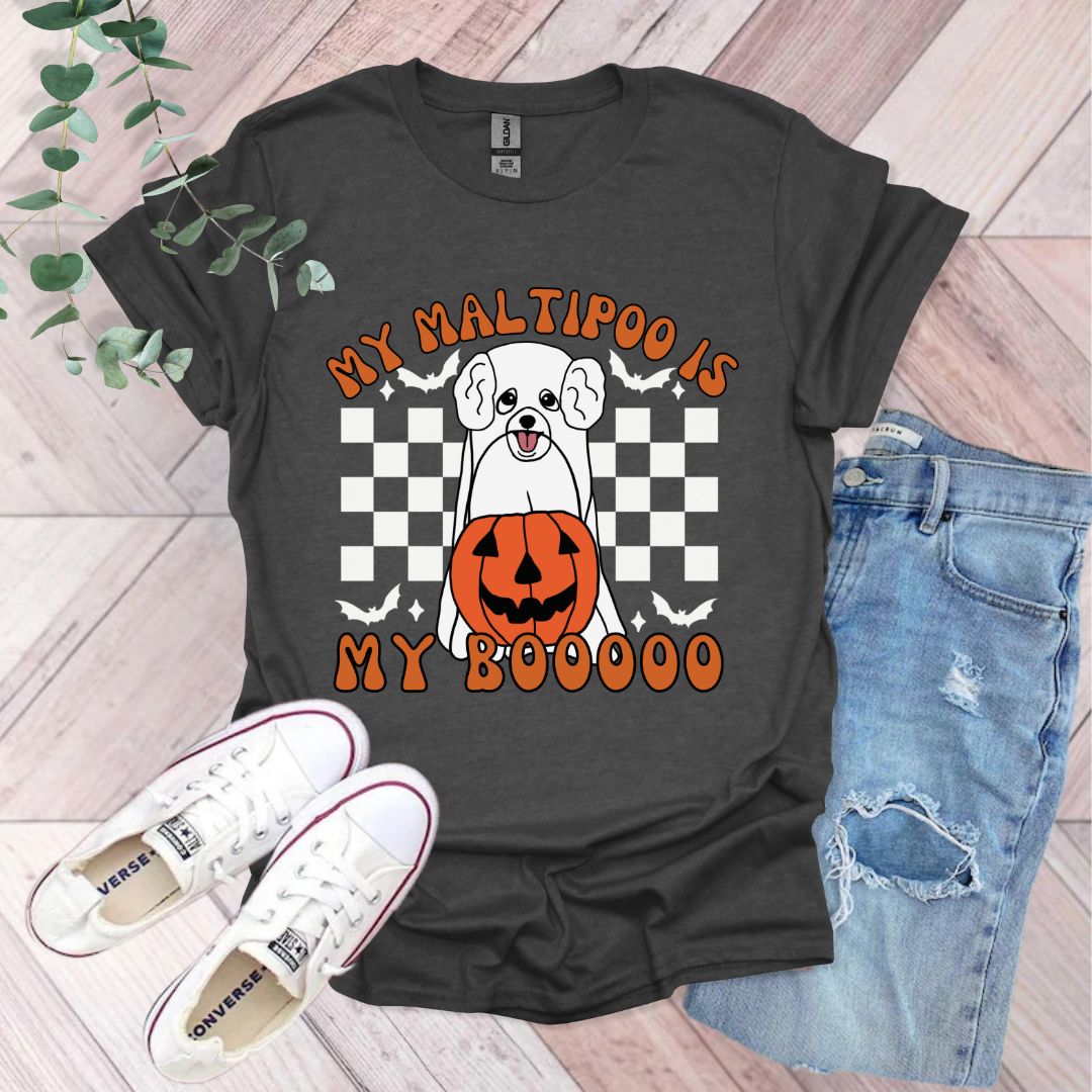 a black shirt with a dog wearing a pumpkin on it
