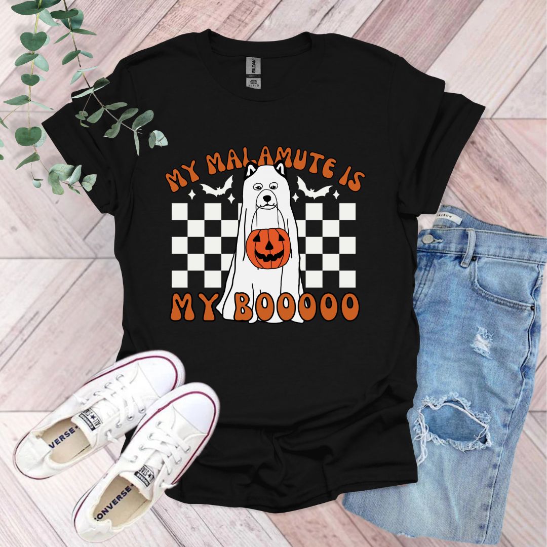 a black shirt with a white dog wearing a jack - o'- lantern pumpkin