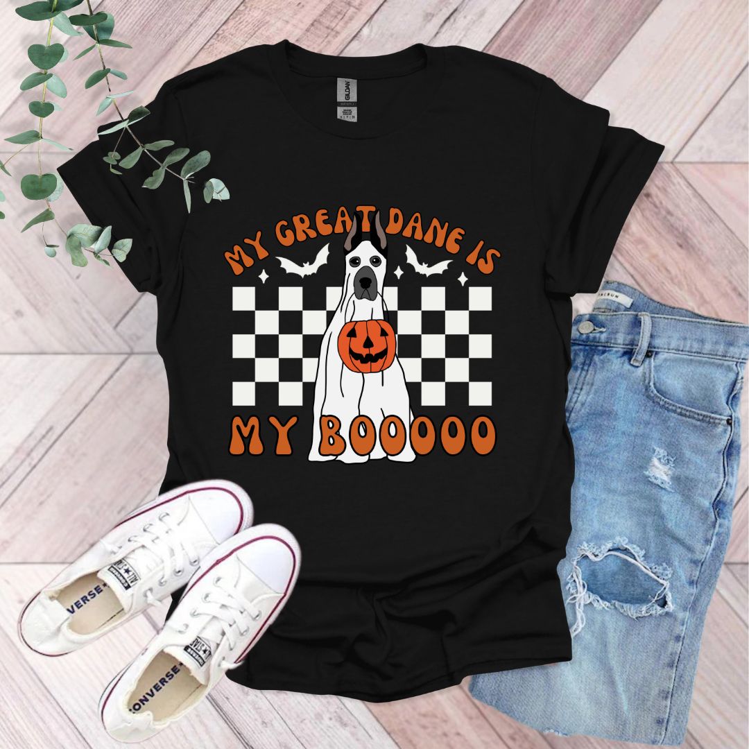 a black t - shirt with a ghost and pumpkin on it