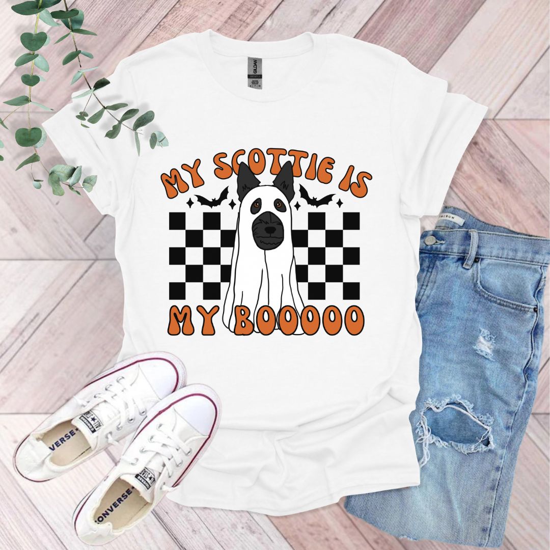 a white t - shirt with a black and white dog on it