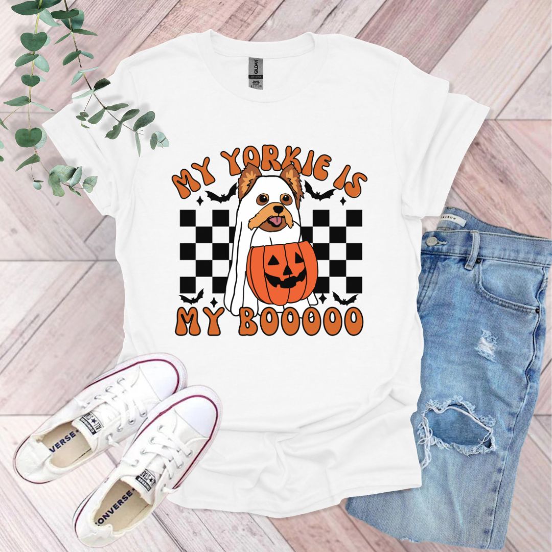 a white t - shirt with a pumpkin and a jack - o'- lantern