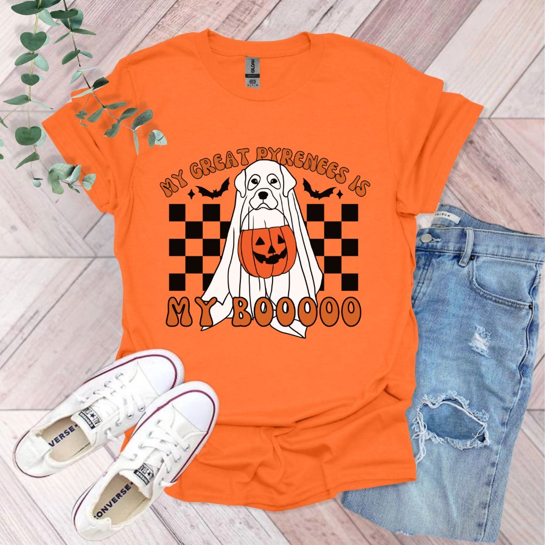 an orange shirt with a dog wearing a pumpkin on it