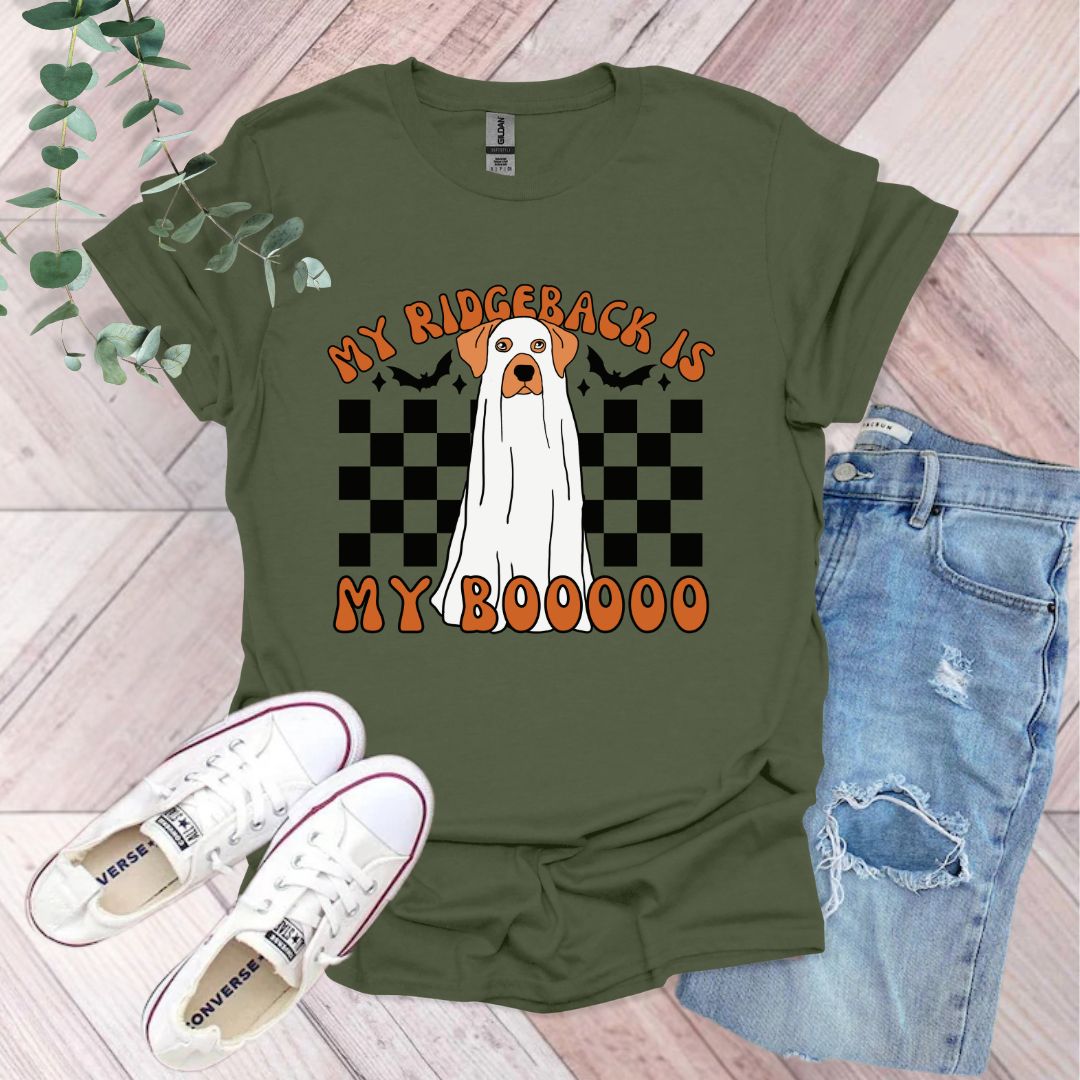 a green shirt with a white dog on it