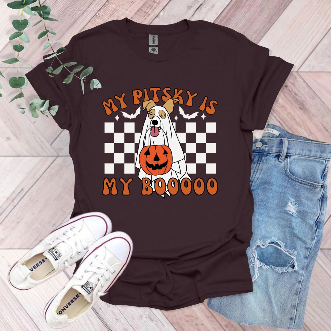 a t - shirt with a dog in a pumpkin costume on it