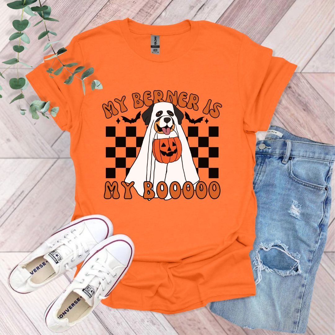 an orange shirt with a black and white dog on it