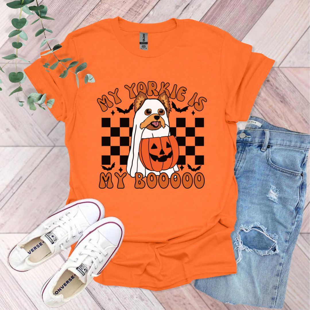 an orange shirt with a picture of a pumpkin on it