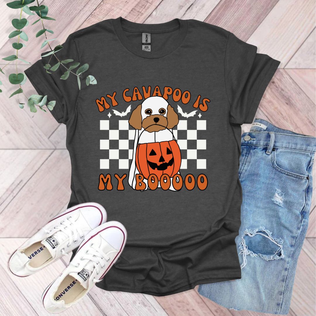 a black shirt with a dog wearing a pumpkin costume