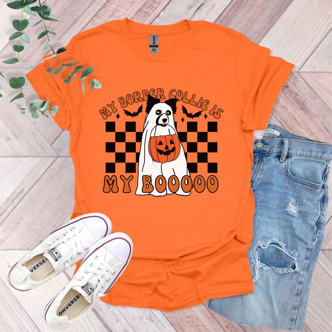 an orange shirt with a ghost and pumpkin on it