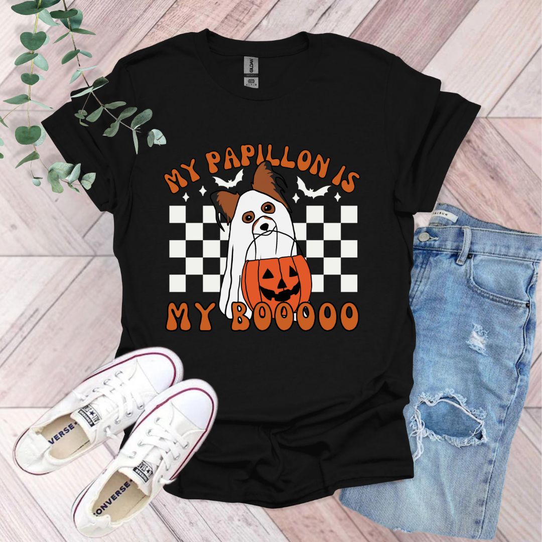 a black shirt with an orange and white dog on it