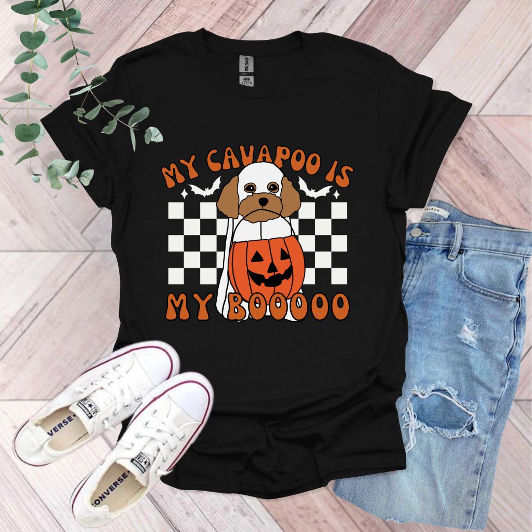 a black shirt with a dog wearing a pumpkin costume