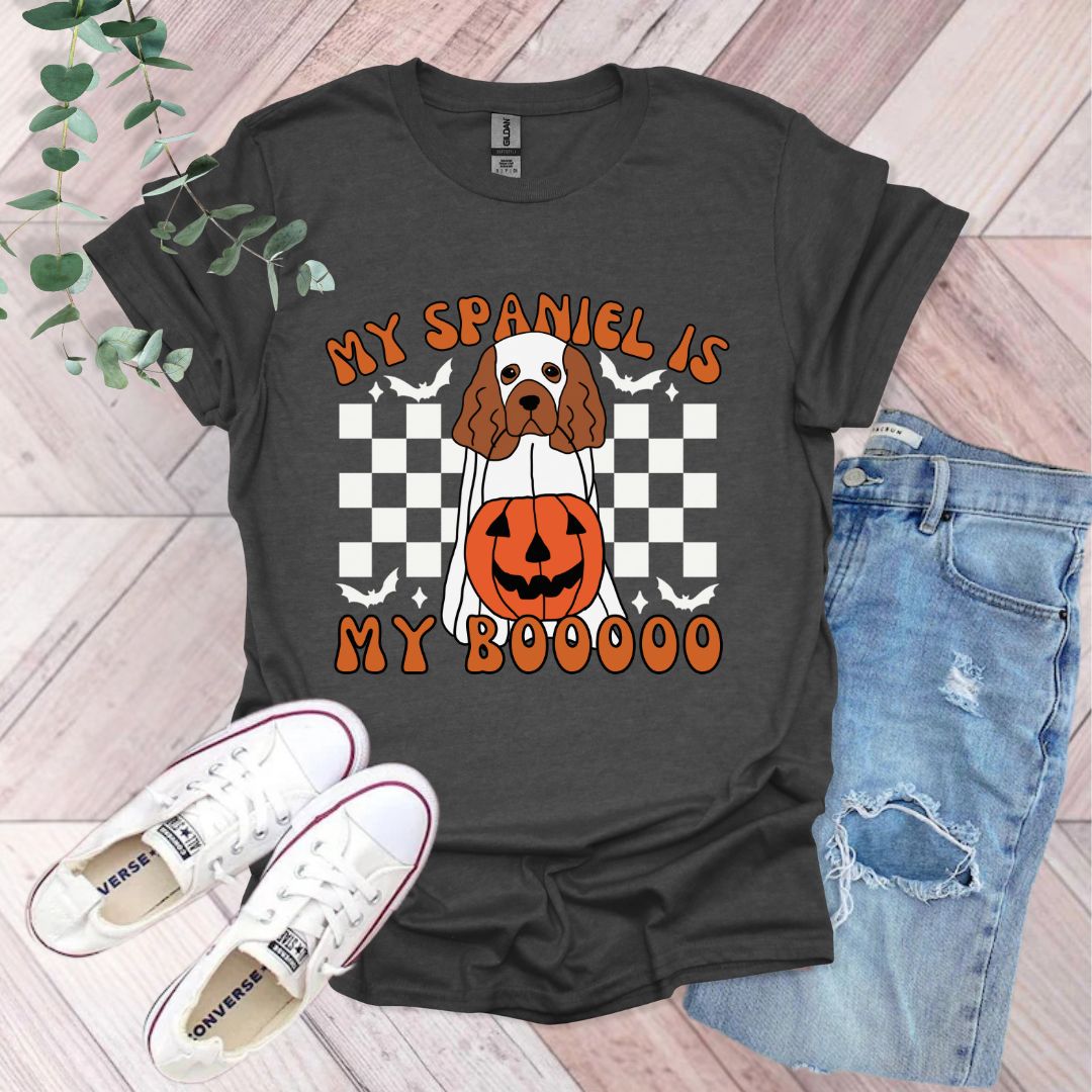 a black shirt with a dog wearing a pumpkin on it
