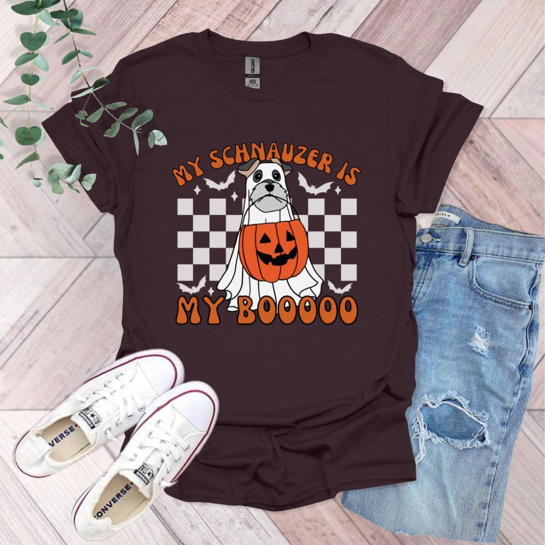 a shirt with a dog wearing a pumpkin on it