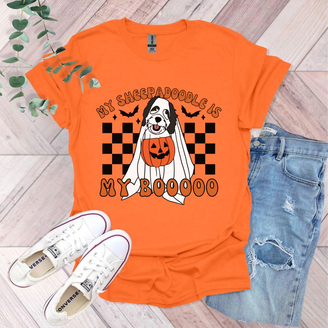 an orange shirt with a black and white dog on it