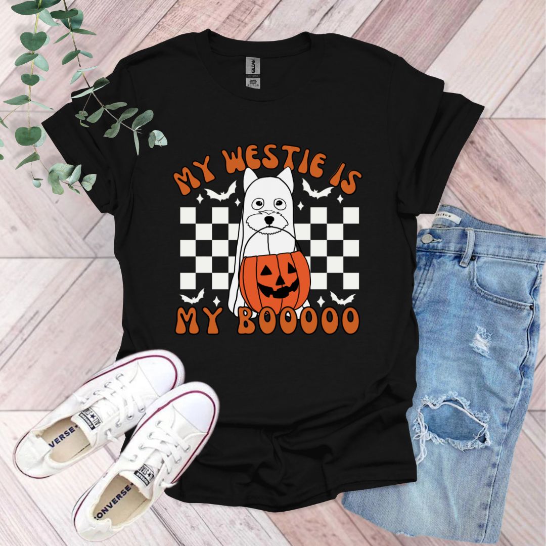 a black shirt with a dog wearing a jack - o'- lantern on it