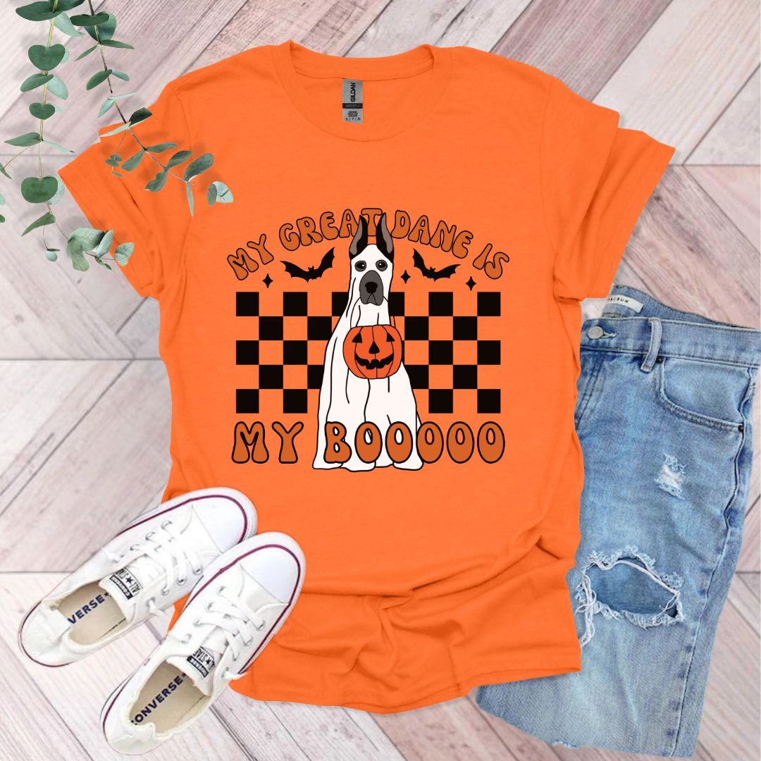 an orange shirt with a black and white dog on it