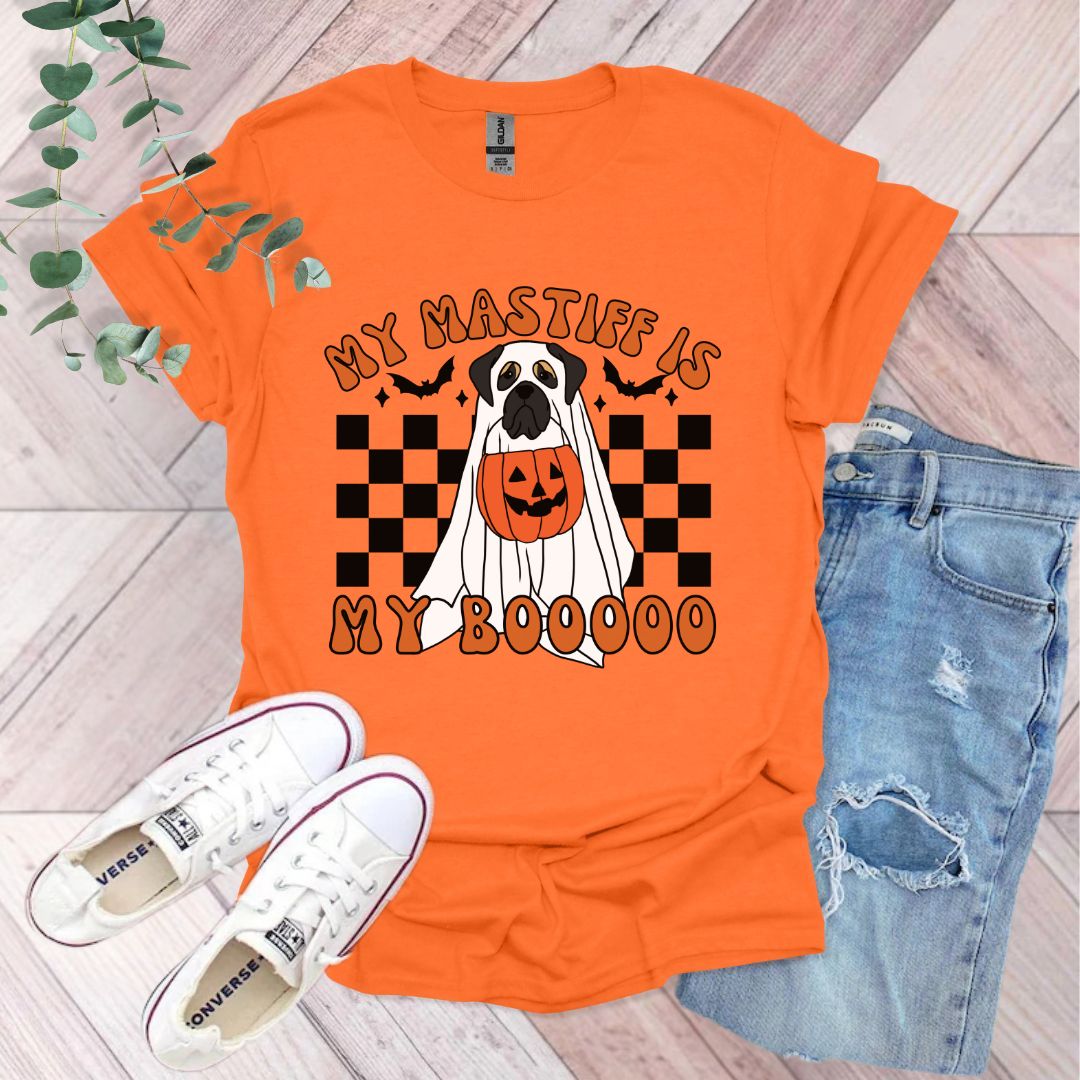 an orange shirt with a black and white dog on it