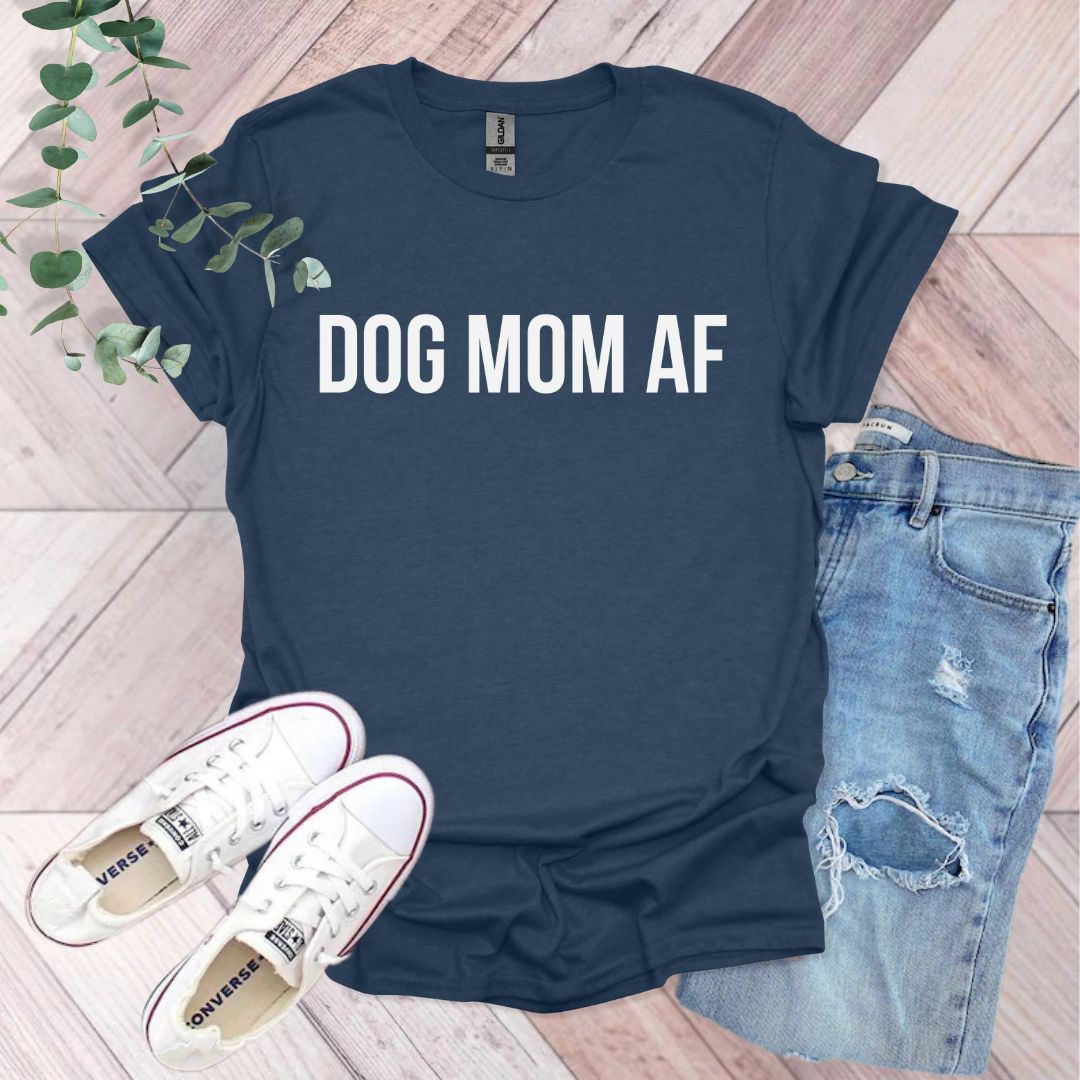 a t - shirt that says dog mom af next to a pair of jeans