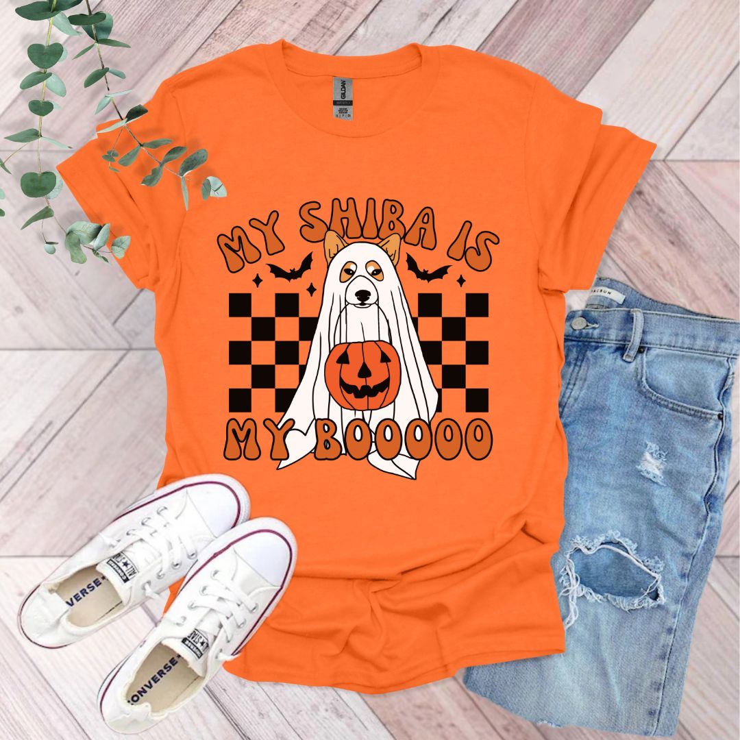 an orange shirt with a ghost and pumpkin on it