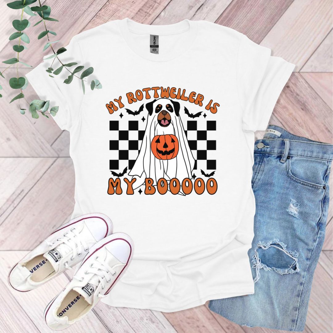 a white shirt with a black and orange dog on it