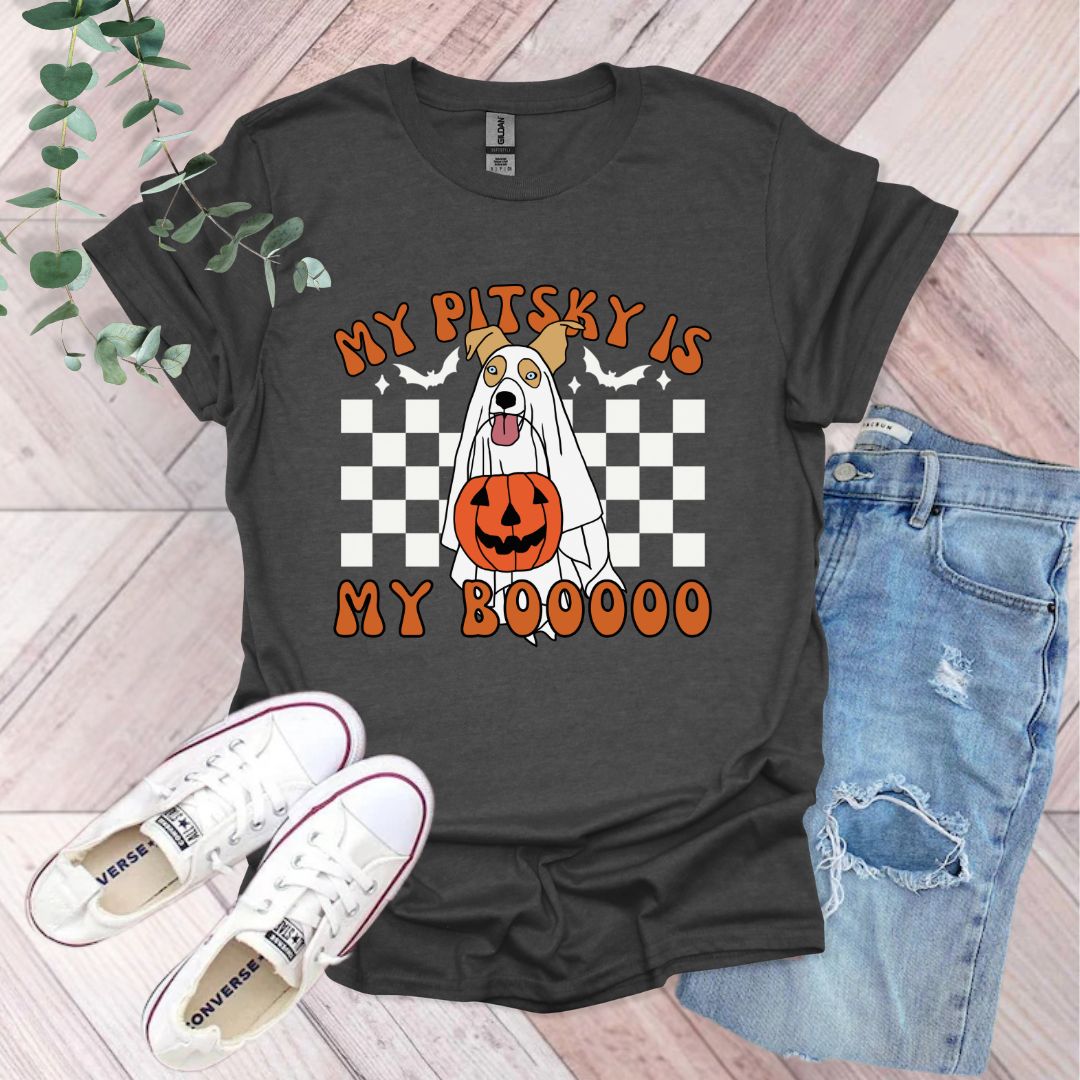 a black shirt with an orange pumpkin on it