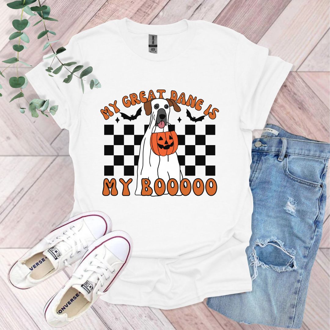 a white dog with a jack - o - lantern pumpkin on it's chest