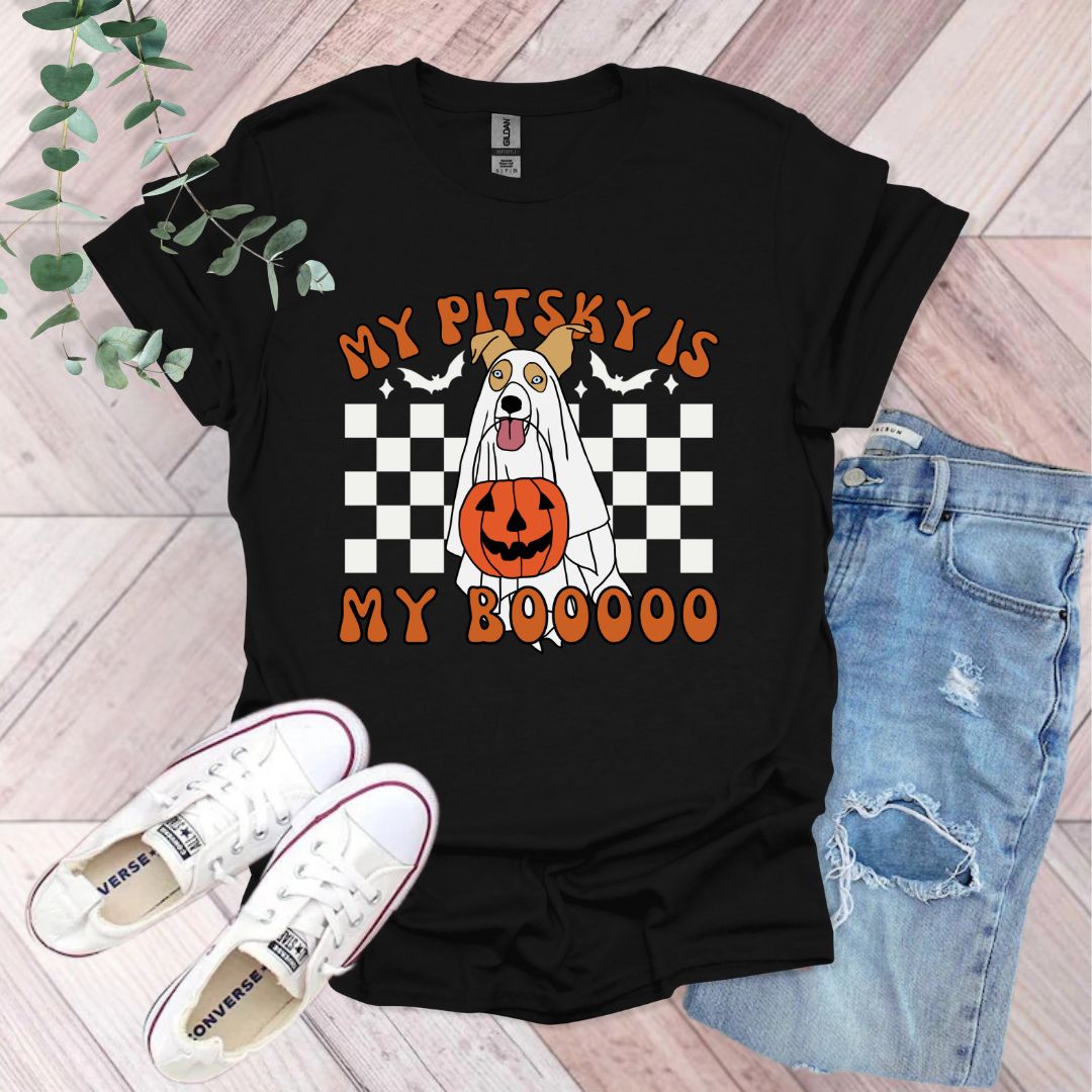 a black shirt with an orange pumpkin on it