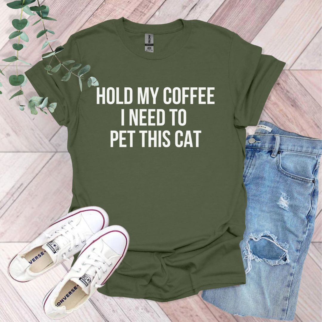 a t - shirt that says hold my coffee i need to pet this cat