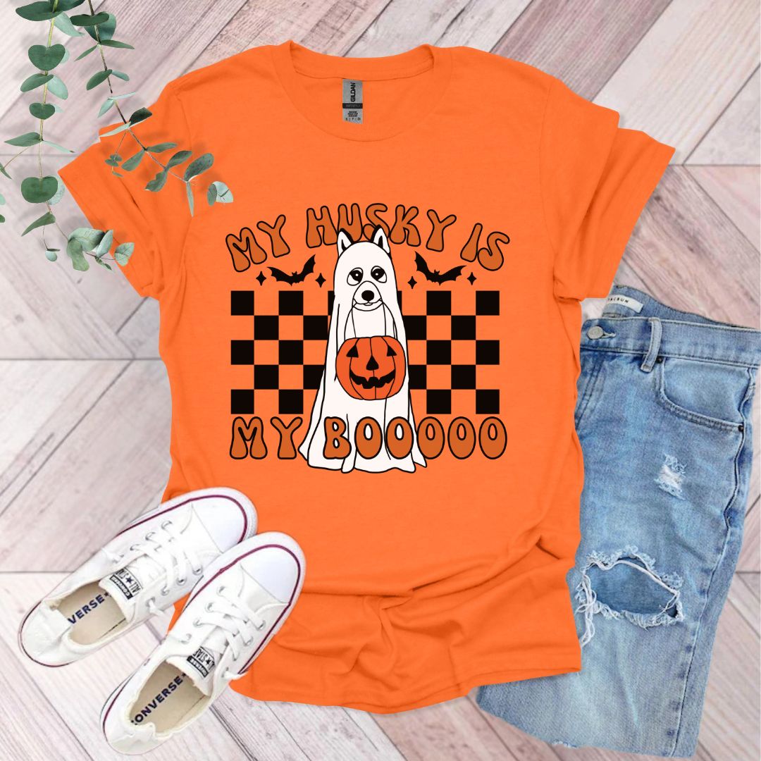 an orange shirt with a ghost and pumpkin on it