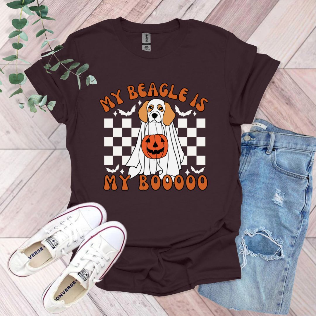 a shirt with a dog wearing a pumpkin on it