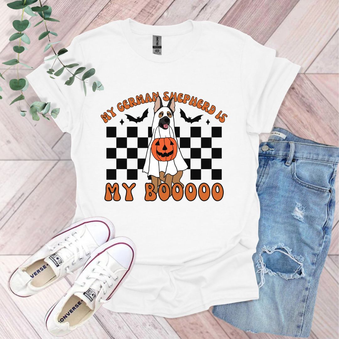 a white t - shirt with an orange pumpkin and a jack - o - lantern