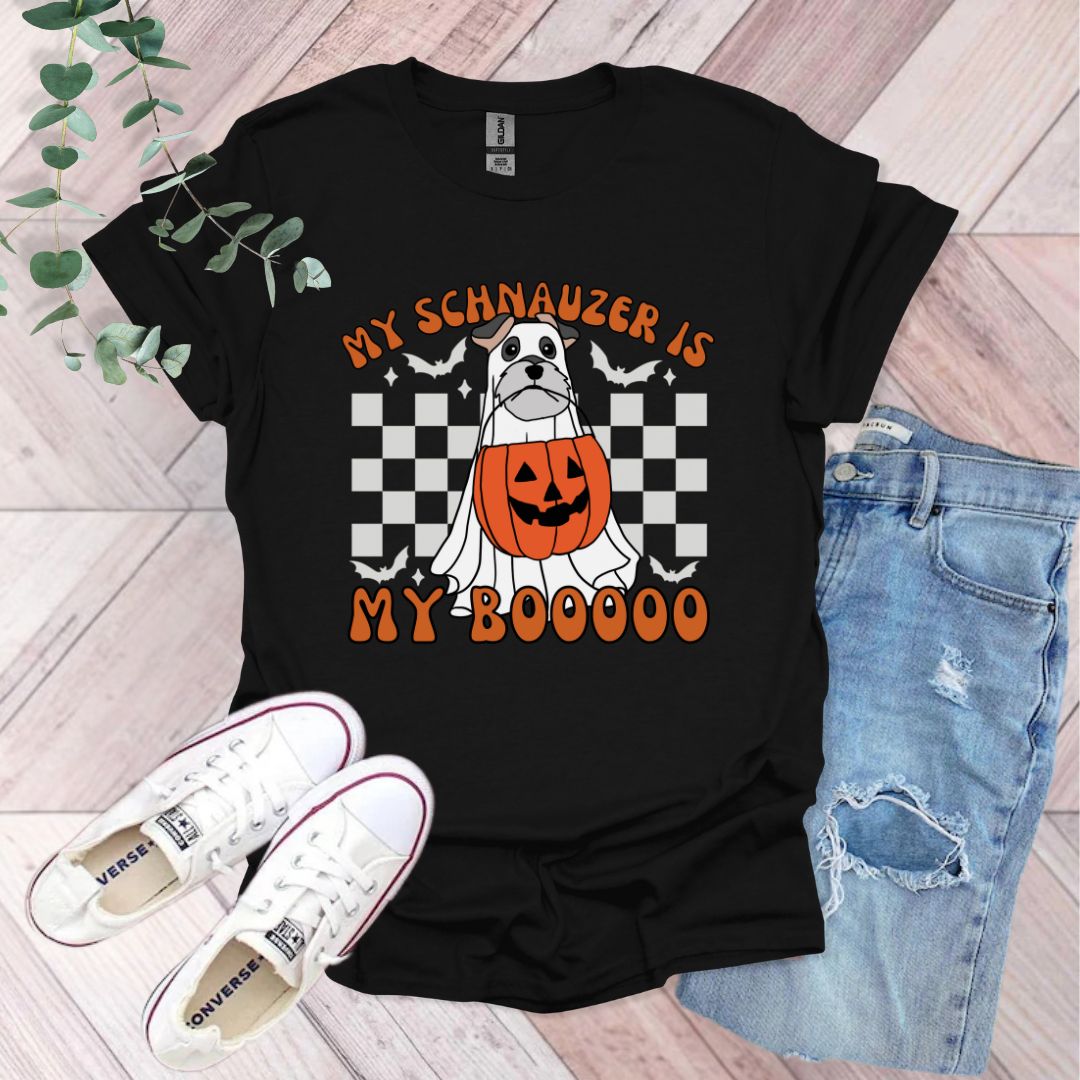 a black shirt with an orange pumpkin on it