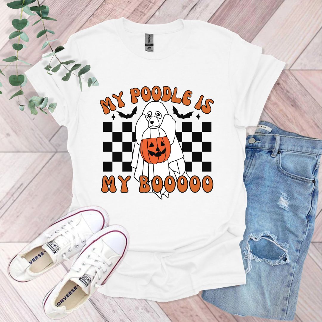 a white t - shirt with an orange pumpkin on it