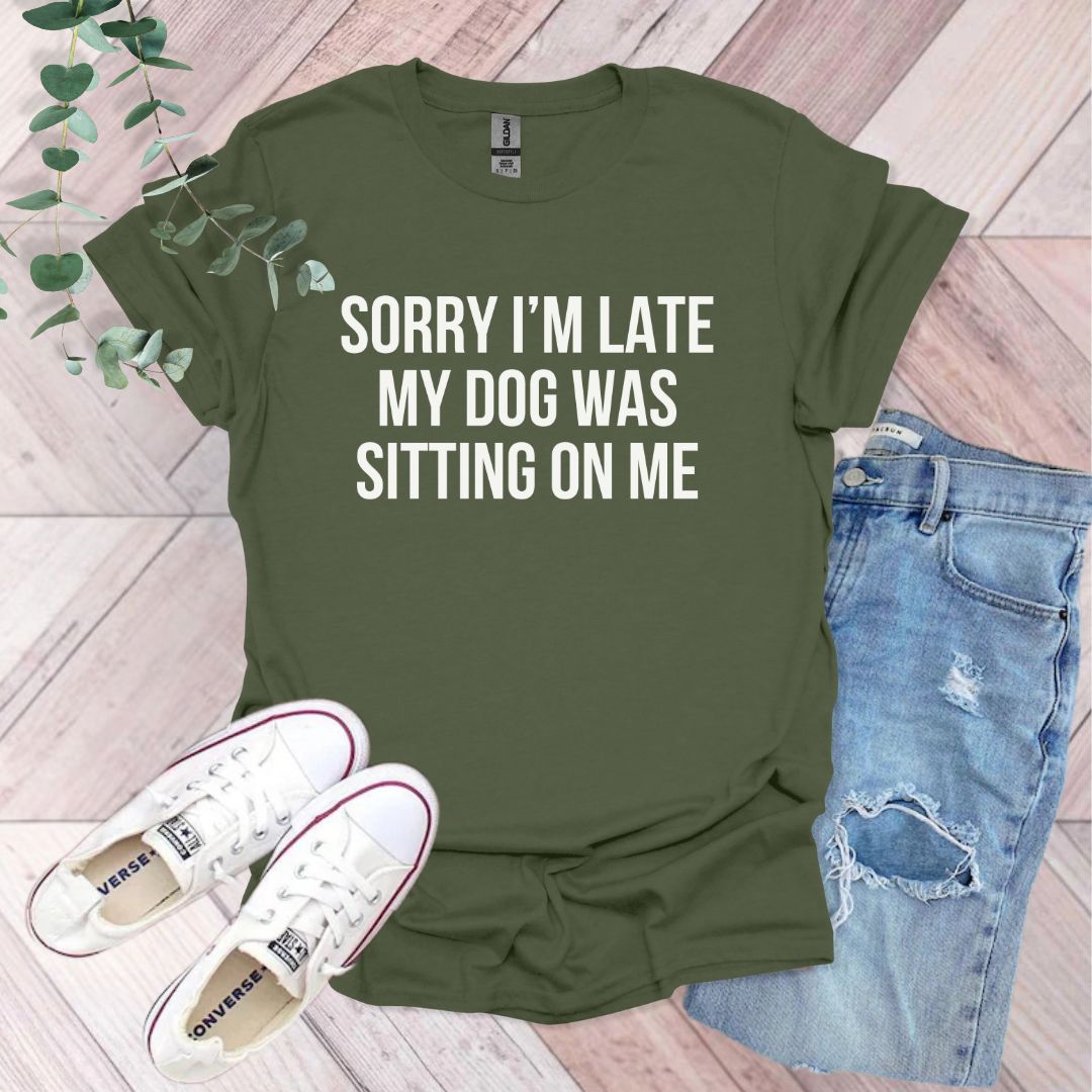 a t - shirt that says sorry i'm late my dog was sitting on