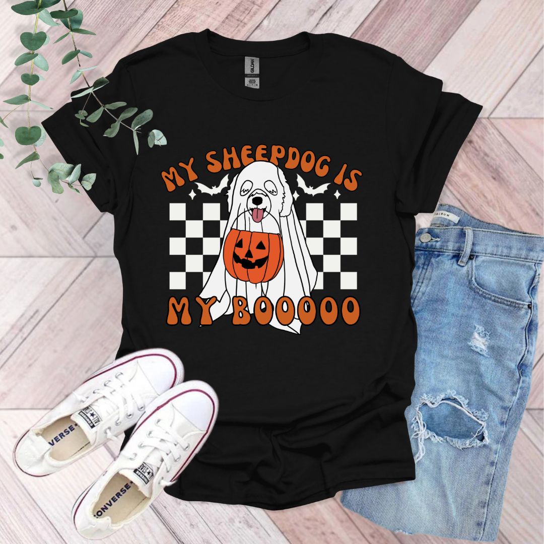 a black shirt with a white dog wearing a pumpkin on it