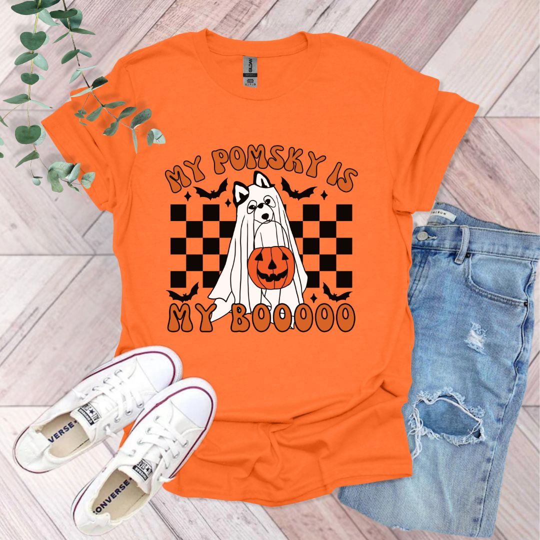 an orange shirt that says my possy is my boooo
