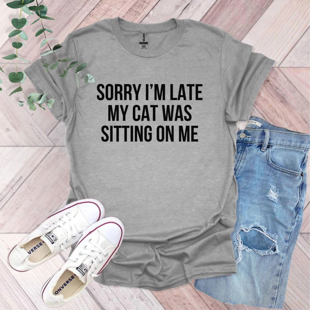 a t - shirt that says sorry i'm late my cat was sitting on
