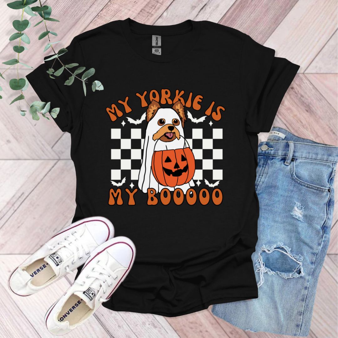 a black shirt with a pumpkin and a jack - o'- lantern on it