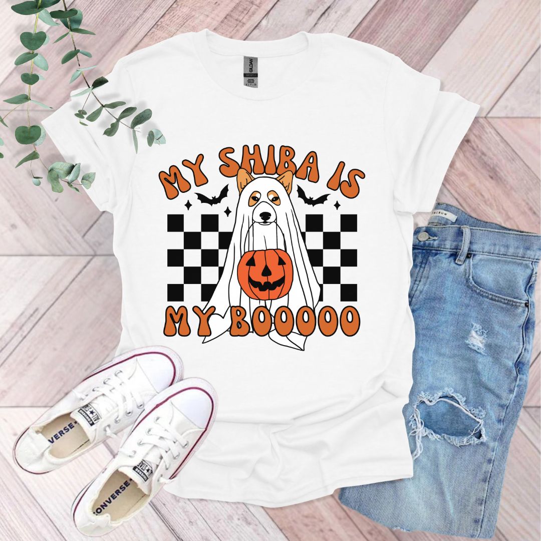 a white t - shirt with an orange pumpkin on it