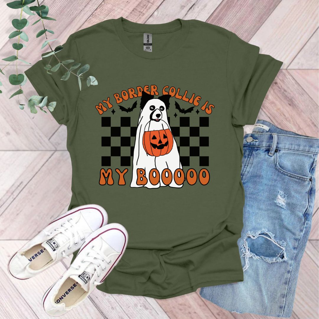 a green shirt with a ghost on it
