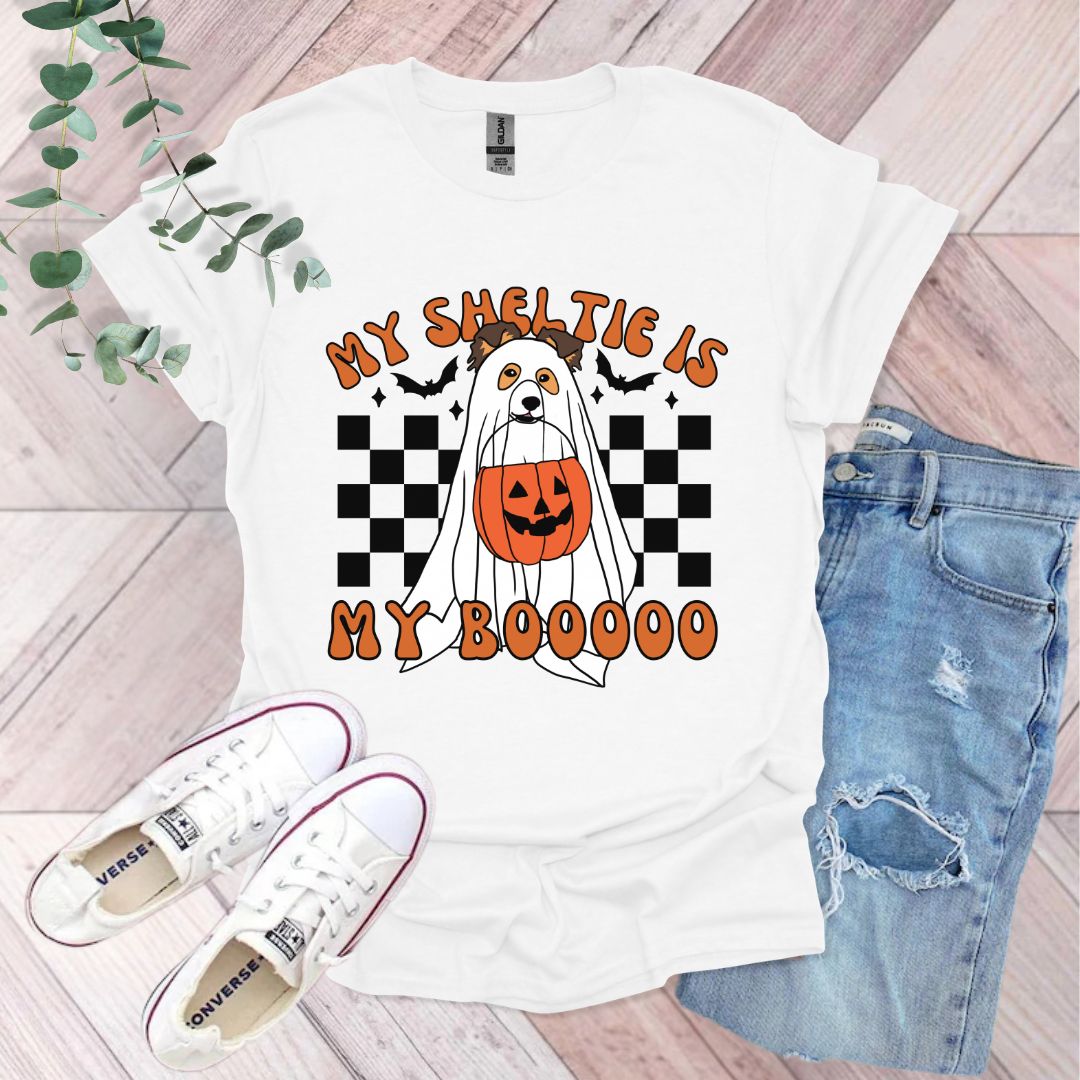 a white t - shirt with an orange pumpkin on it