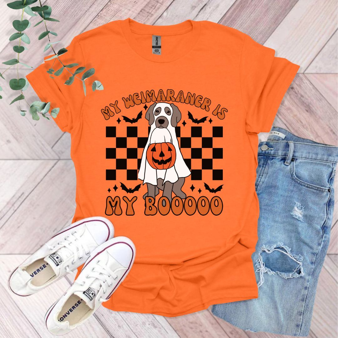 an orange shirt with a dog wearing a pumpkin costume