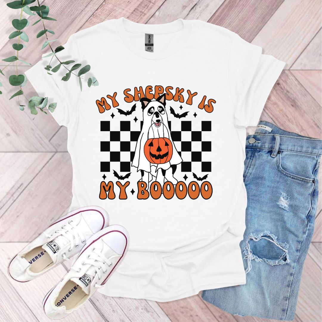 a white t - shirt with a pumpkin on it