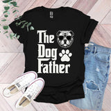 a t - shirt that says the dog father with a dog's paw on