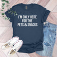 a t - shirt that says i'm only here for the pets and snacks