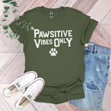 a t - shirt that says pawstive vibes only with a paw print on