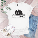 a white shirt with a black cat reading a book