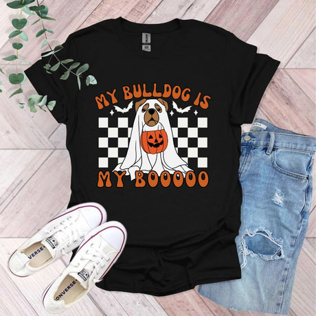 a black shirt with a dog wearing a pumpkin on it