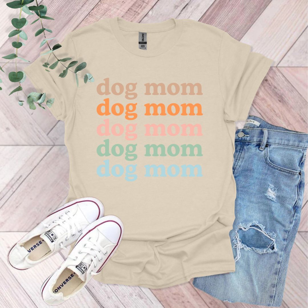 a t - shirt that says dog mom and a pair of jeans