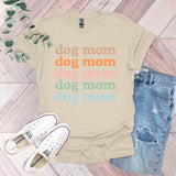 a t - shirt that says dog mom and a pair of jeans