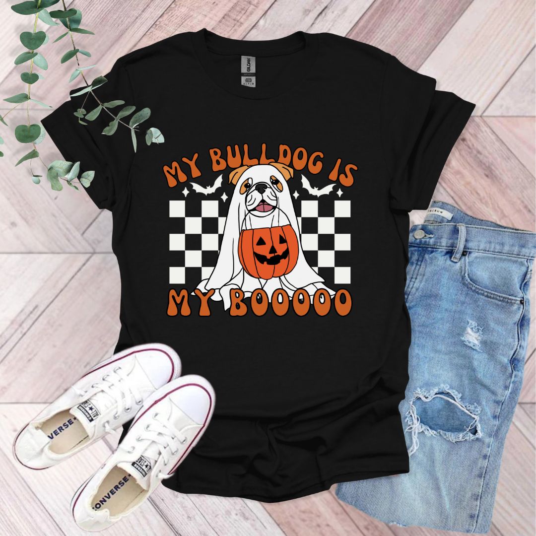 a black shirt with a dog wearing a pumpkin on it